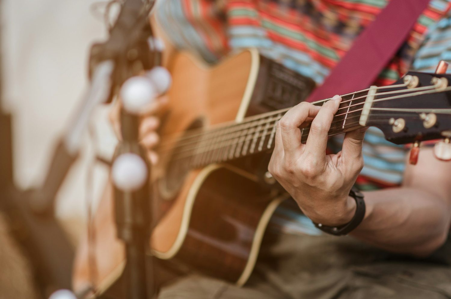 A man playing guitar on stage at a music festival. Concert,mini concert and music festivals.